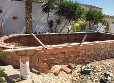 Construction of semi-inground pool by Almeria Pools