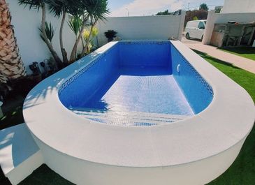 Alternative view of completed semi-inground pool. Built by Almeria Pools